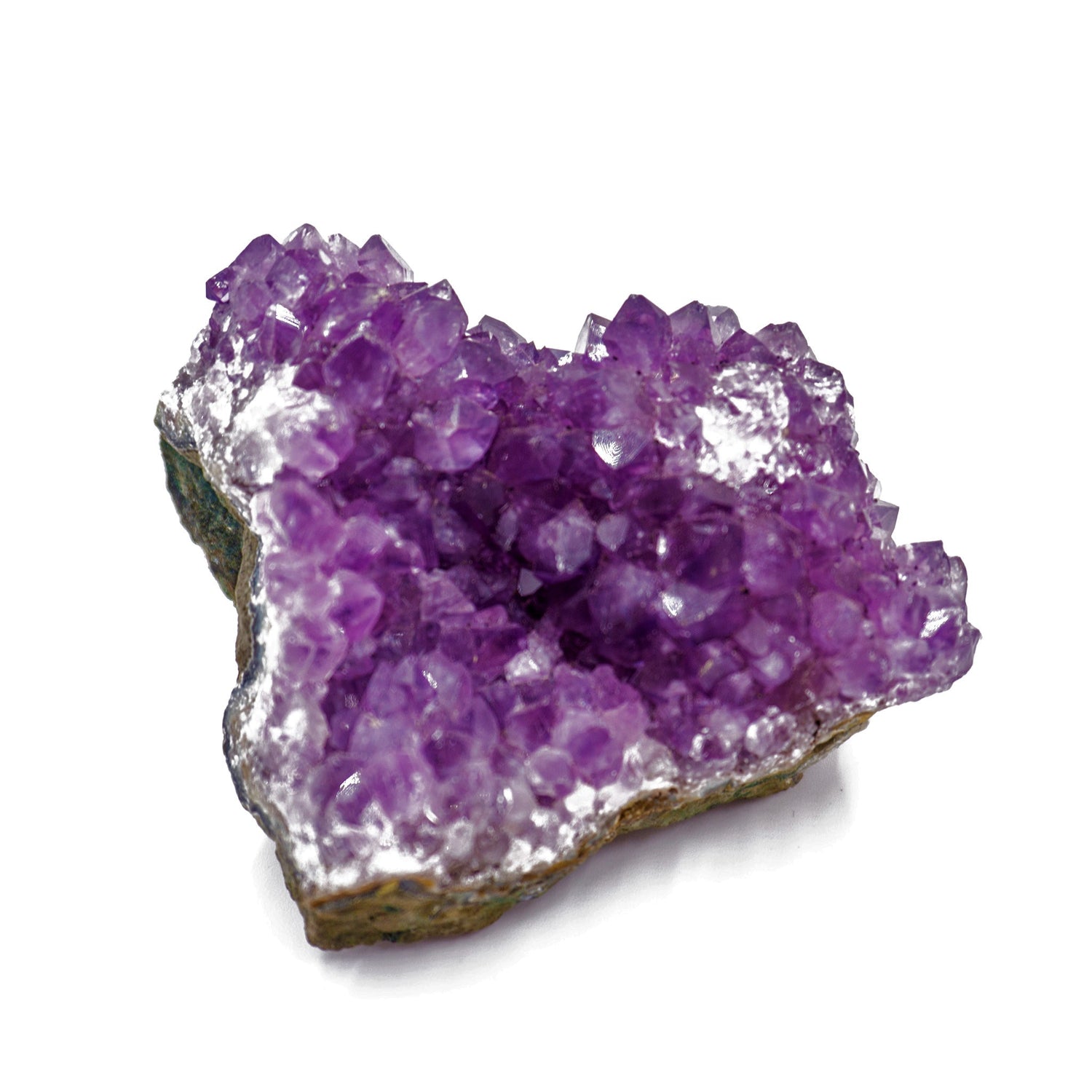 cluster of amethyst crystals on stone base