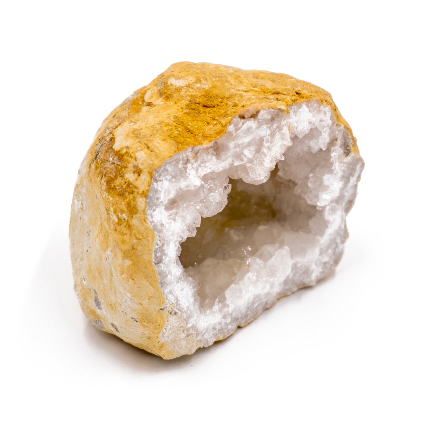 yellow stone cut in half to reveal a white crystal geode