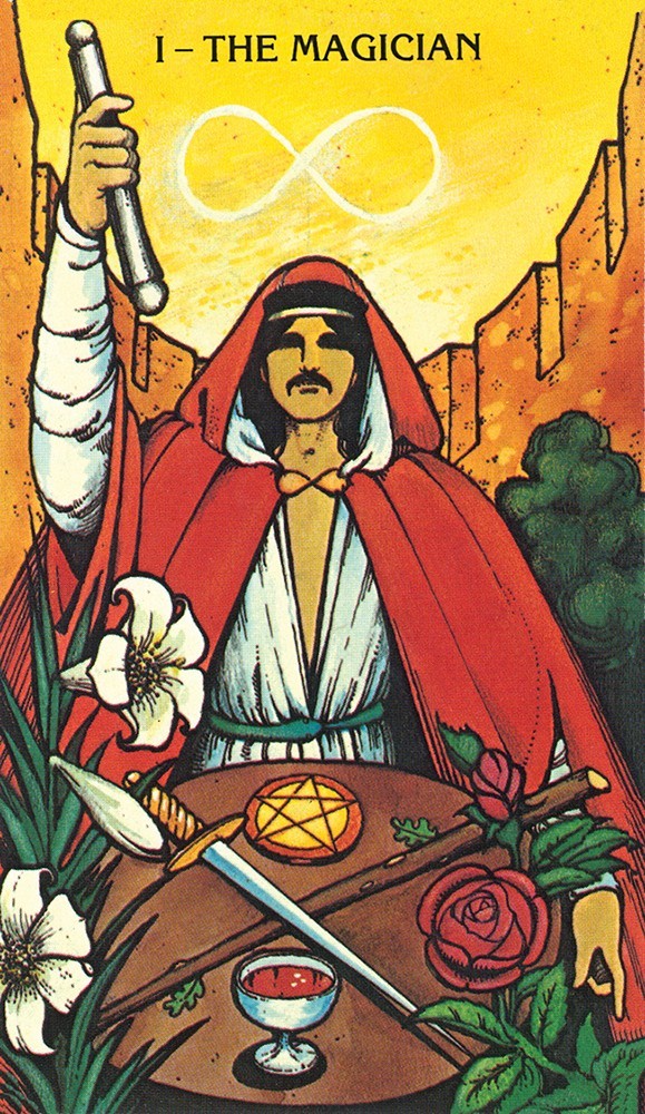 card labled "the magician." depicts a man in a red robe with an infinity symbol floating above his head. on a table in front of him are a cup, a sword, a staff, and a pentacle