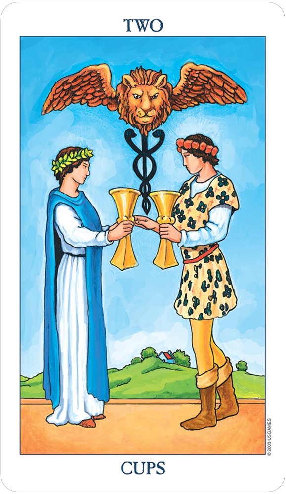 card labeled "two of cups." depicts a couple gazing longingly at each other while holding cups.